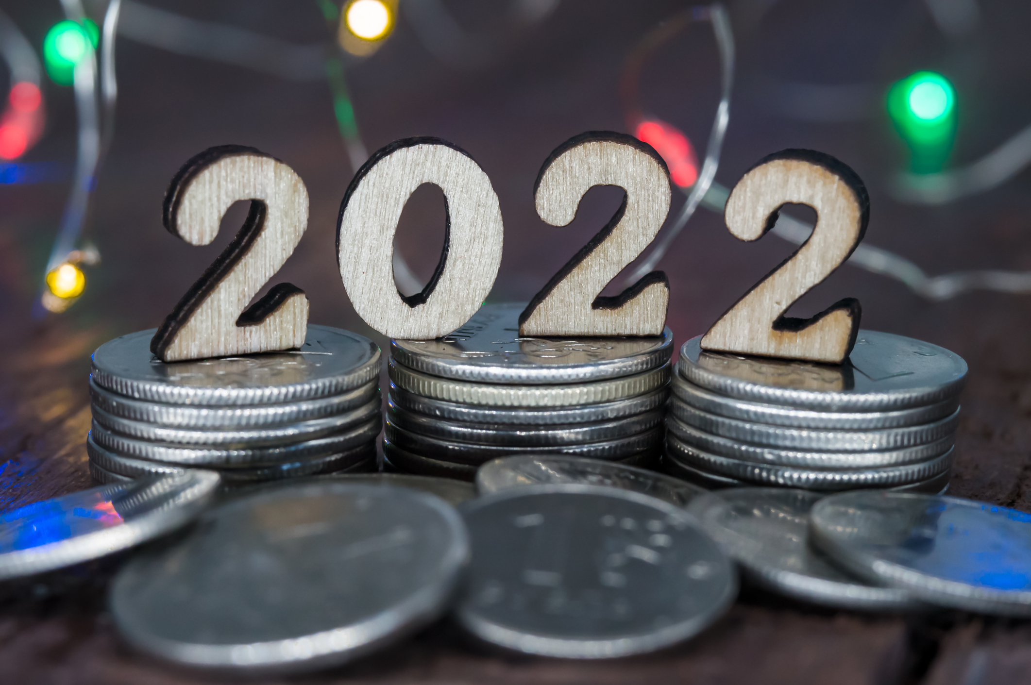 Banner 2022. Coins and Figures 2022. Money stacked in columns.