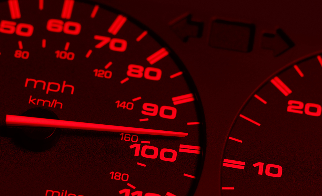 Red speedometer close up