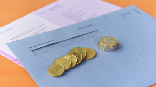 Tax declaration with envelope and Euro coins