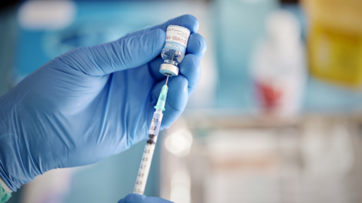 A Healthcare Worker Prepares a Dose of COVID-19 Vaccine.