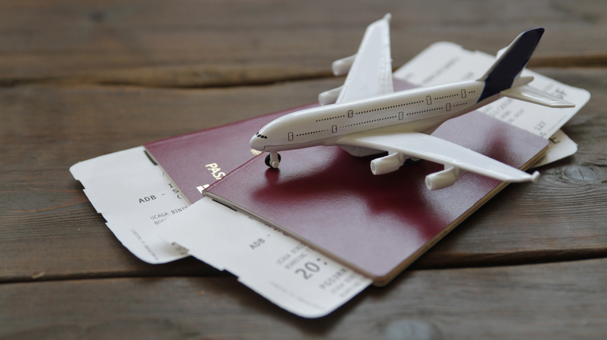 Toy Airplane With Passports and Flight booking ticket. Travel concept.