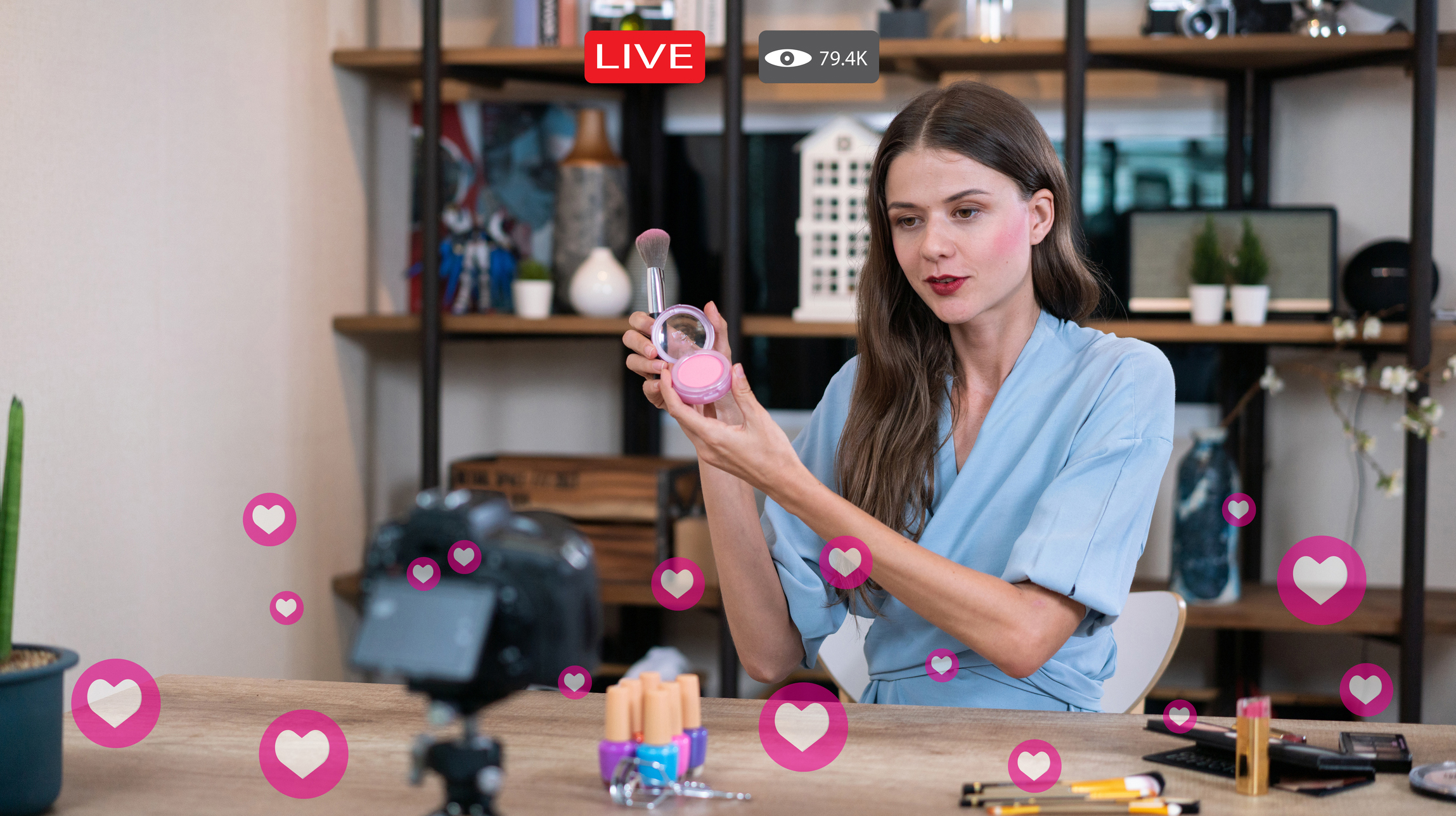 Woman does makeup while recording live stream with video player interface
