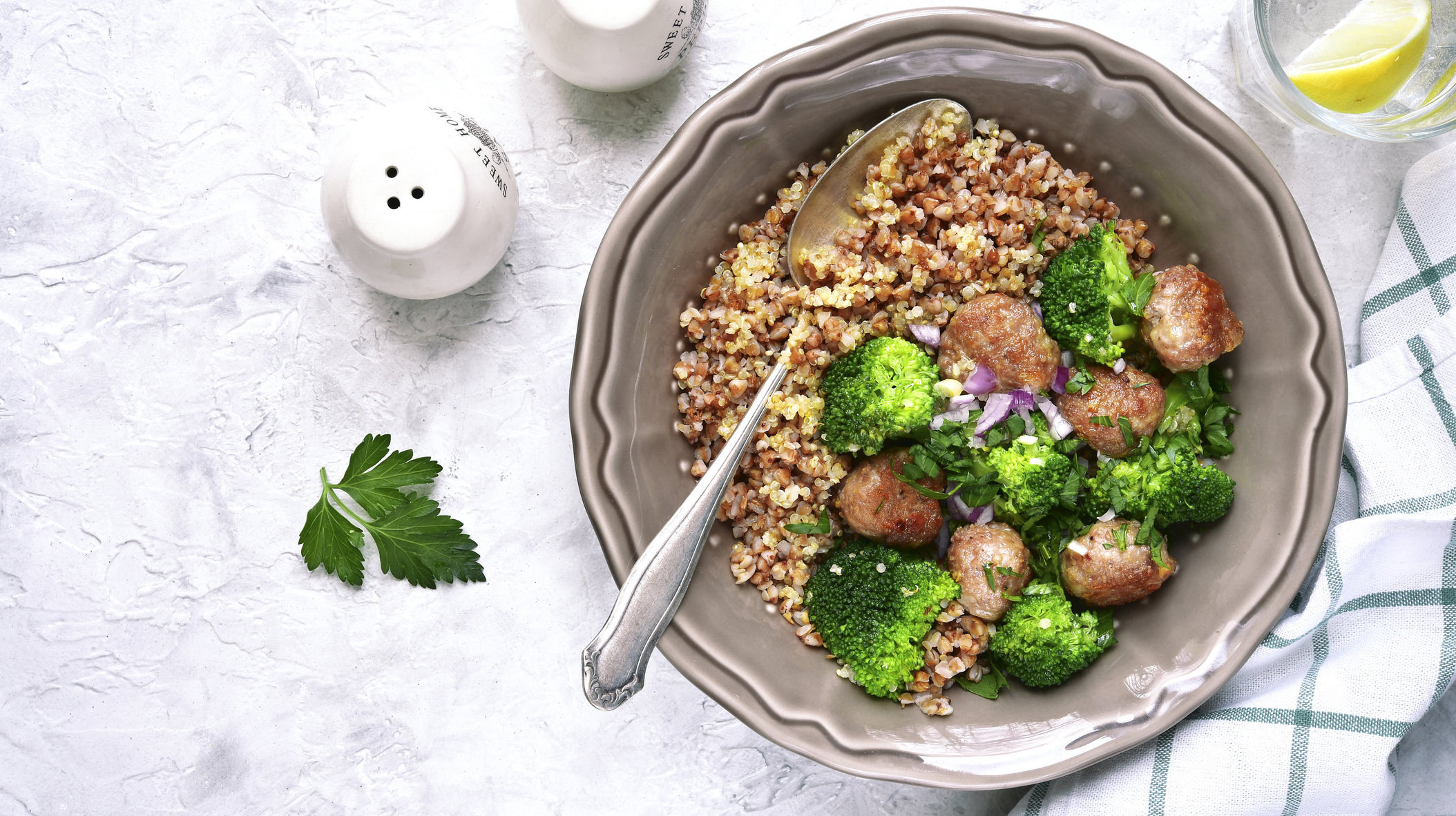Mix of grains with broccoli and fried meatballs.Top view.