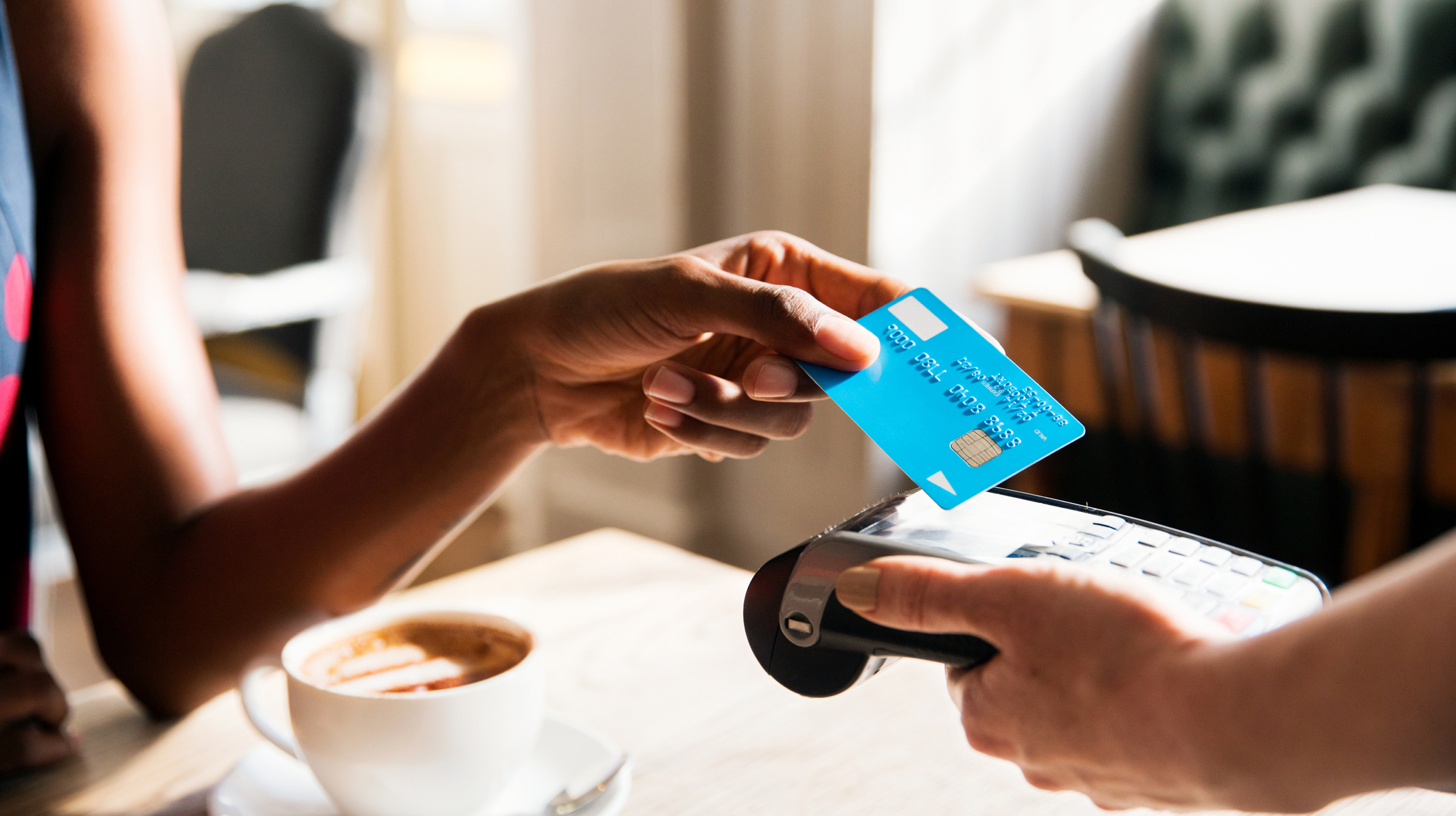Woman using contactless payment, close up
