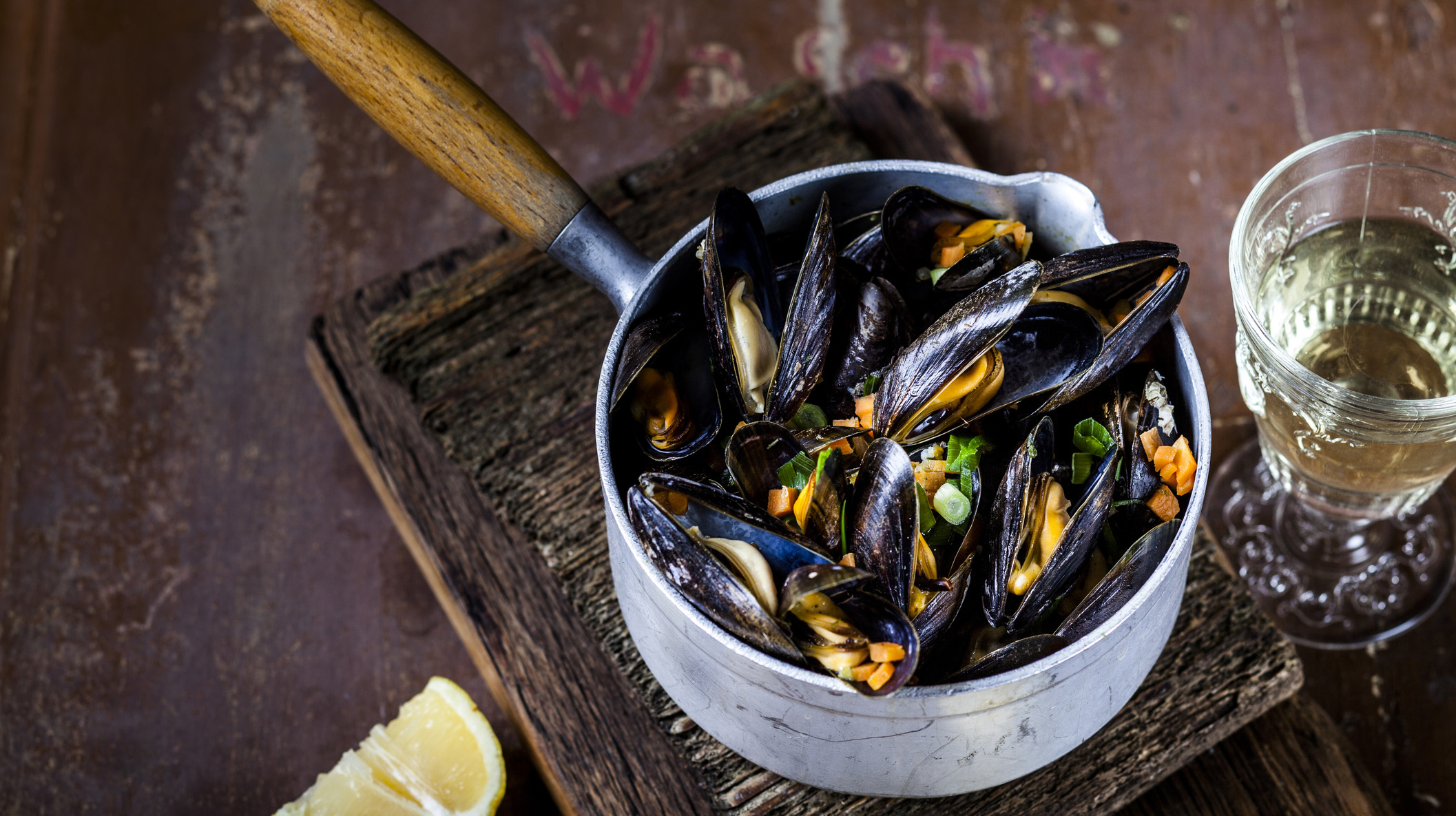 Blue mussels in cooking pot