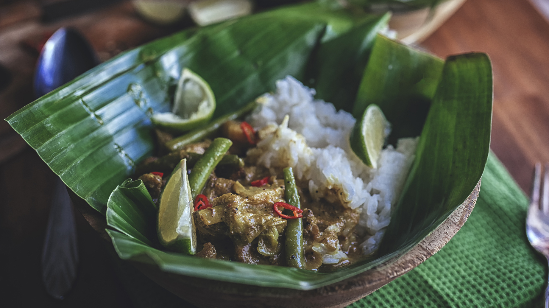 Indonesian Chicken Curry Dish with Rice Served on Banana Leaf