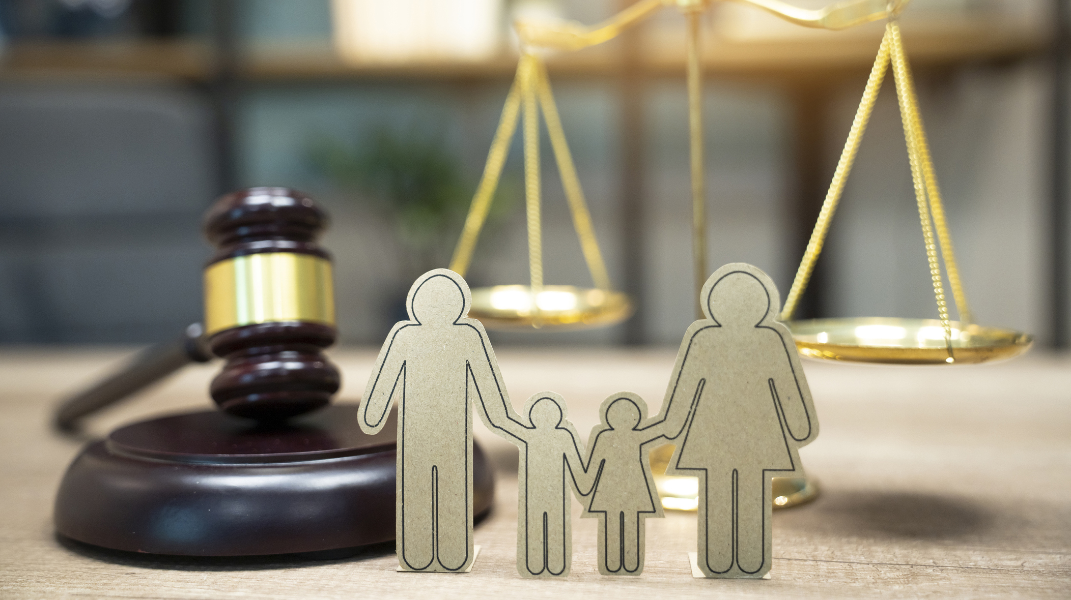 Family figure and gavel on table. Family law concept