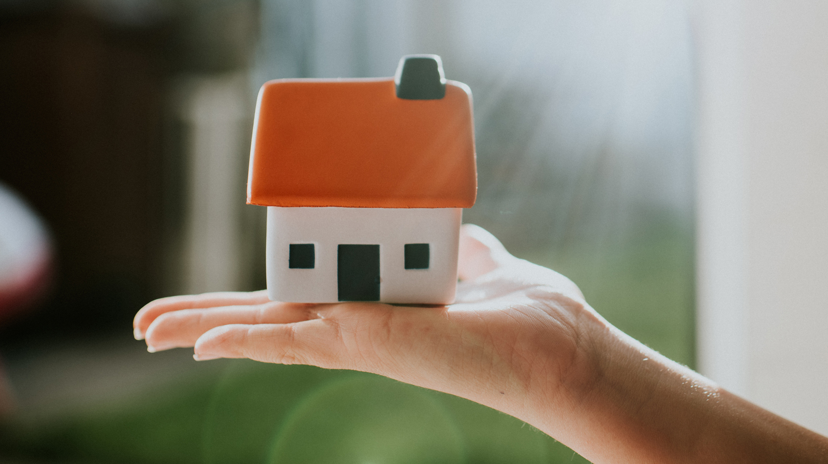 Hand holding House