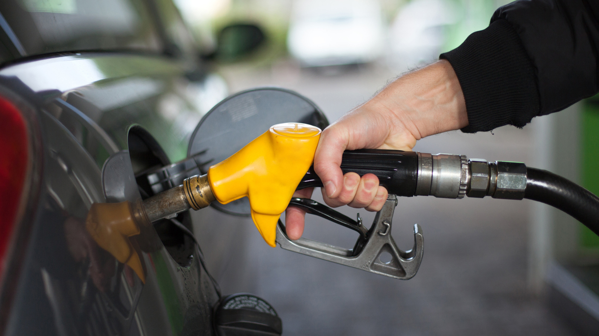 Close-up of hand holding fuel nozzle