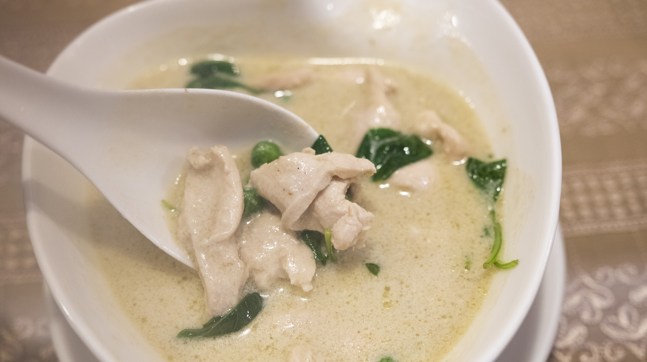 Thai Green Curry Served In Bowl On Table