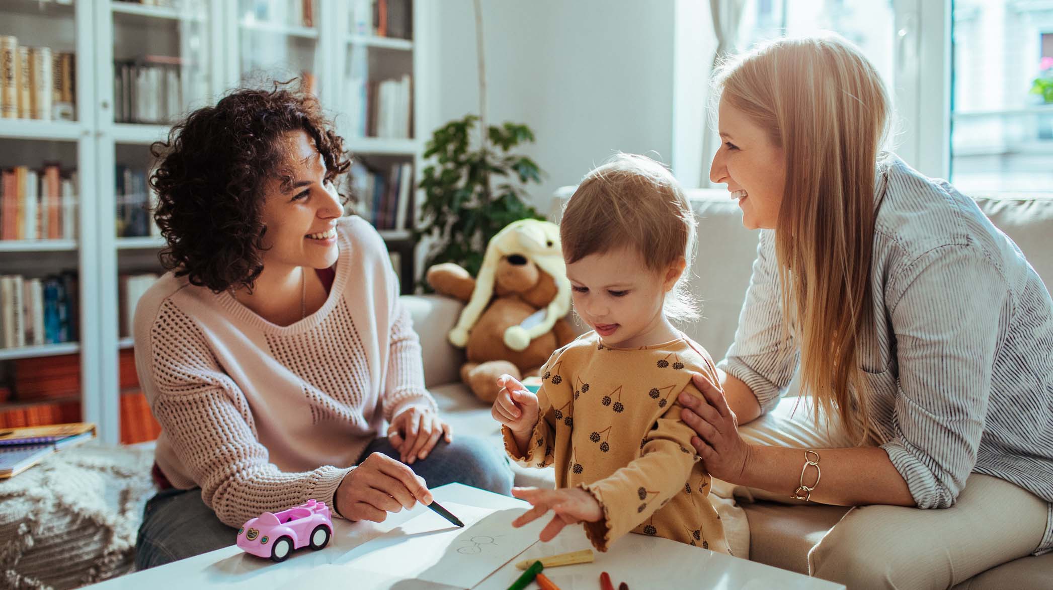 Young family playing in the living room