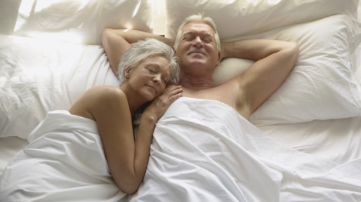 Affectionate Senior Couple in Bed