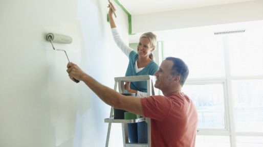 Couple Painting Wall Together