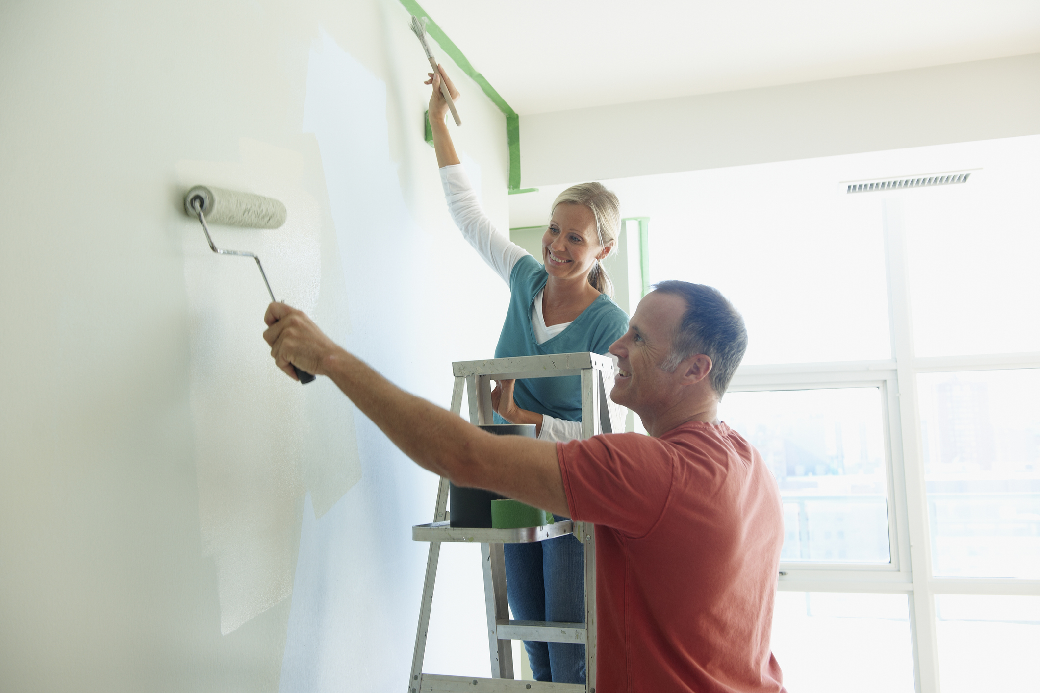 Couple Painting Wall Together