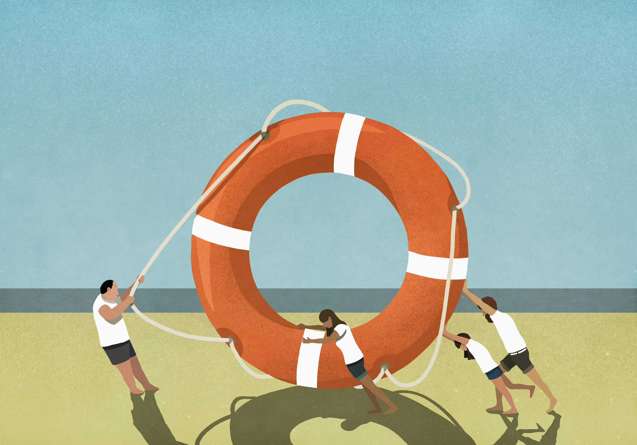 Family pulling and pushing large life ring on beach