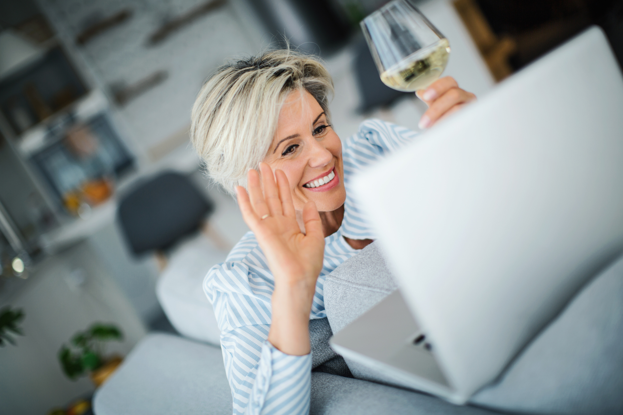 Mature woman using laptop at her home.