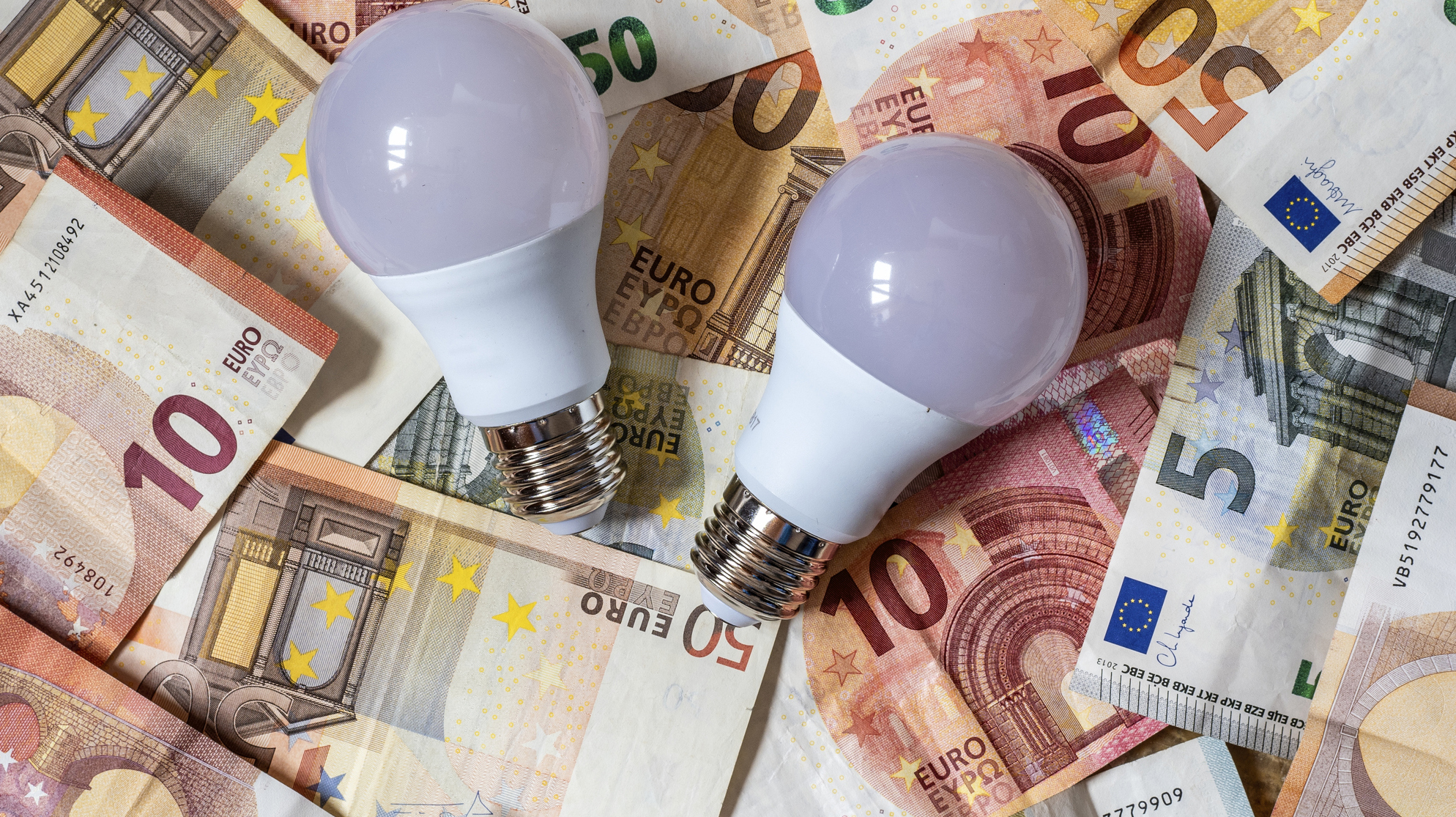Low consumption led light bulb and euro banknotes and coins