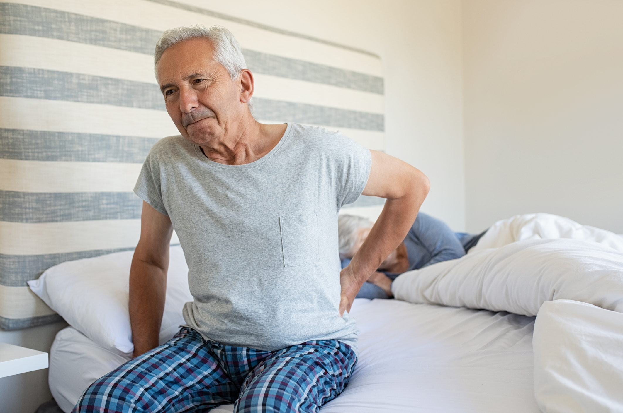 Old man suffering back pain