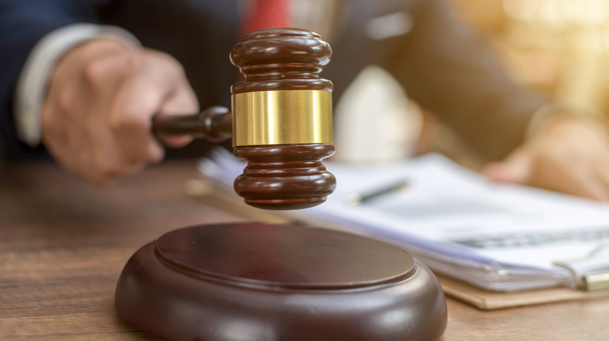 Close up lawyer businessman working or reading lawbook in office workplace for consultant lawyer concept.