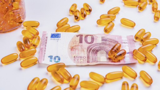 Medicine capsules and ten Euro banknote