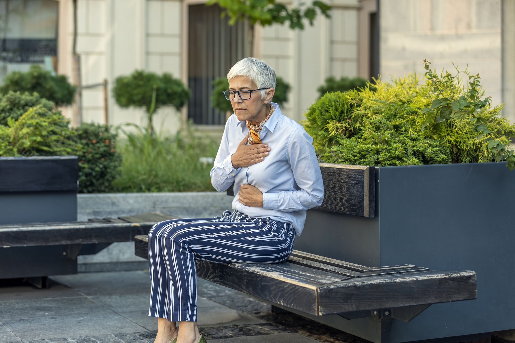 Senior Business Woman is Feeling Sick with Heart Problems