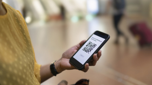Woman holding phone with QR code
