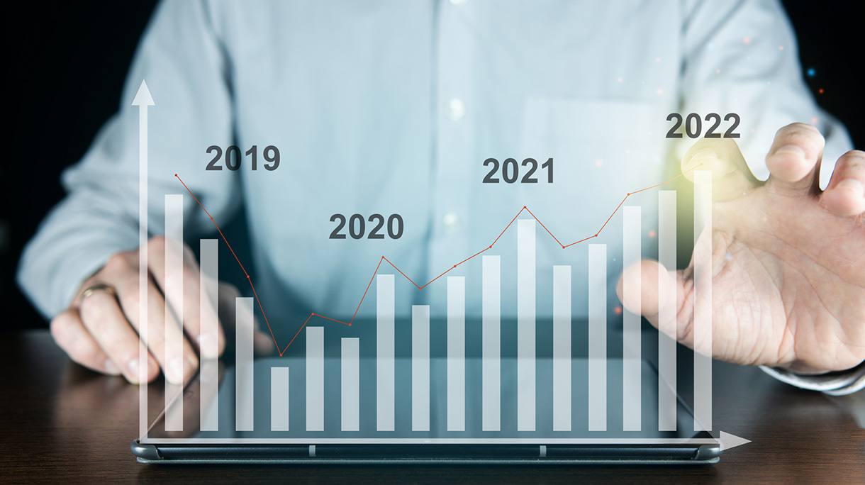 Businessman plan business growth and financial, increase of positive indicators in the year 2022 to increase business growth and an increase for growing up business, touching virtual screen
