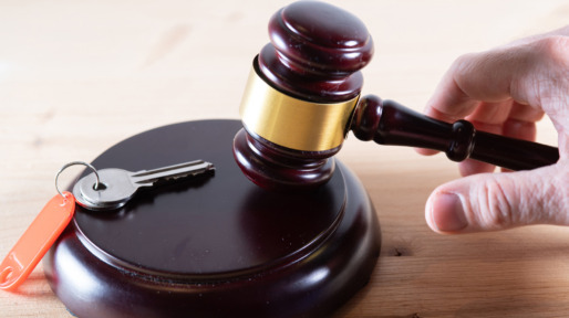Concept of buying a house at auction.