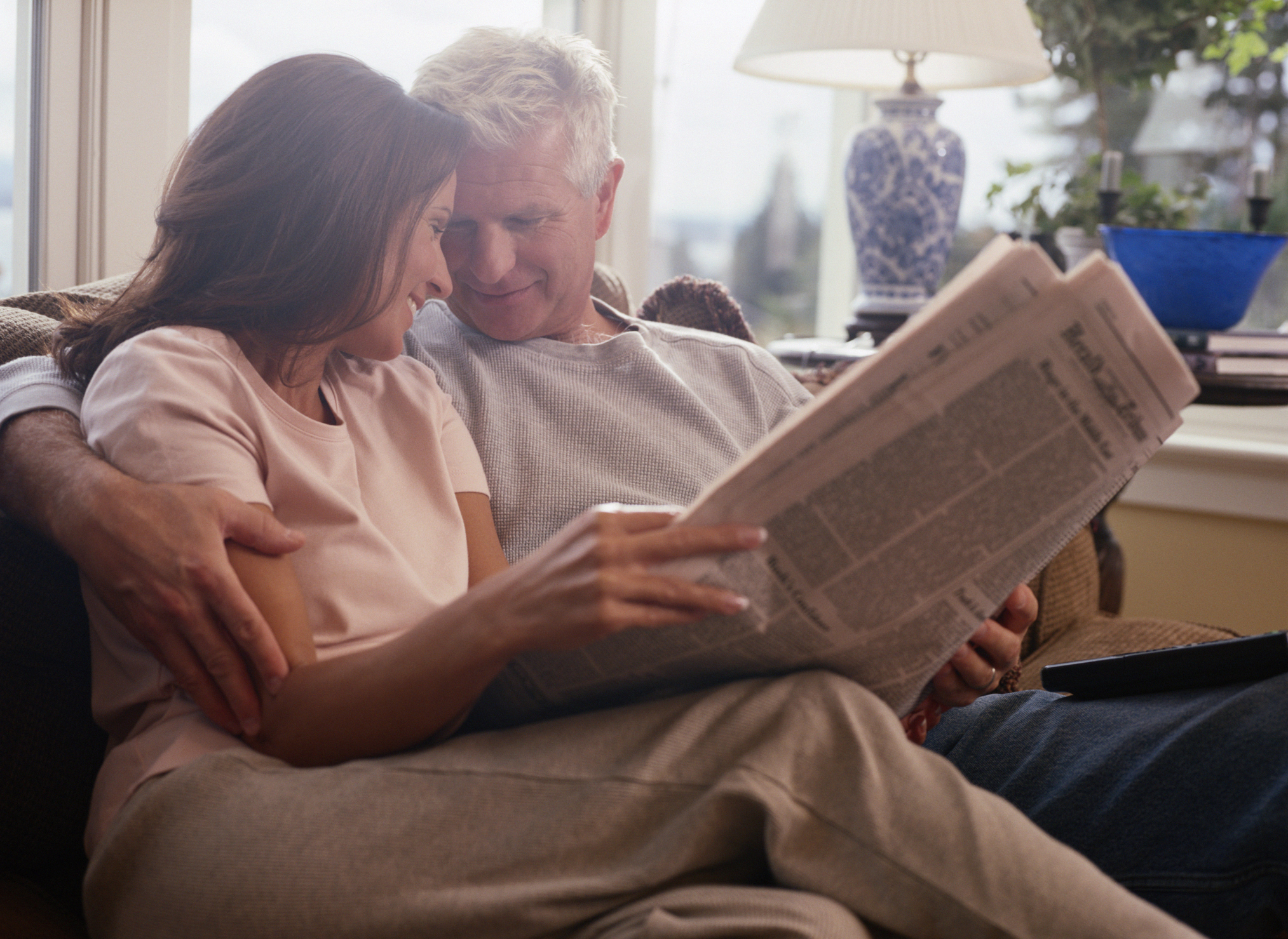 Couple Hugging on a Sofa