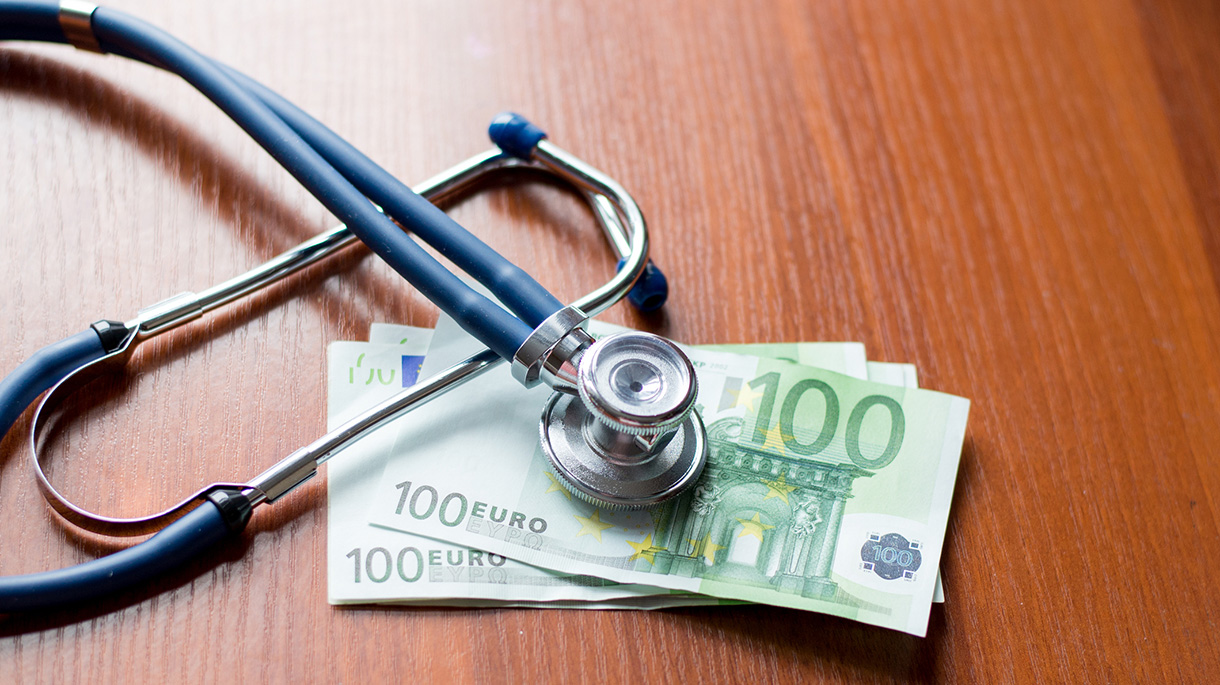 European currency sick concept: stethoscope on euro banknotes. on wooden table background. Health care concept