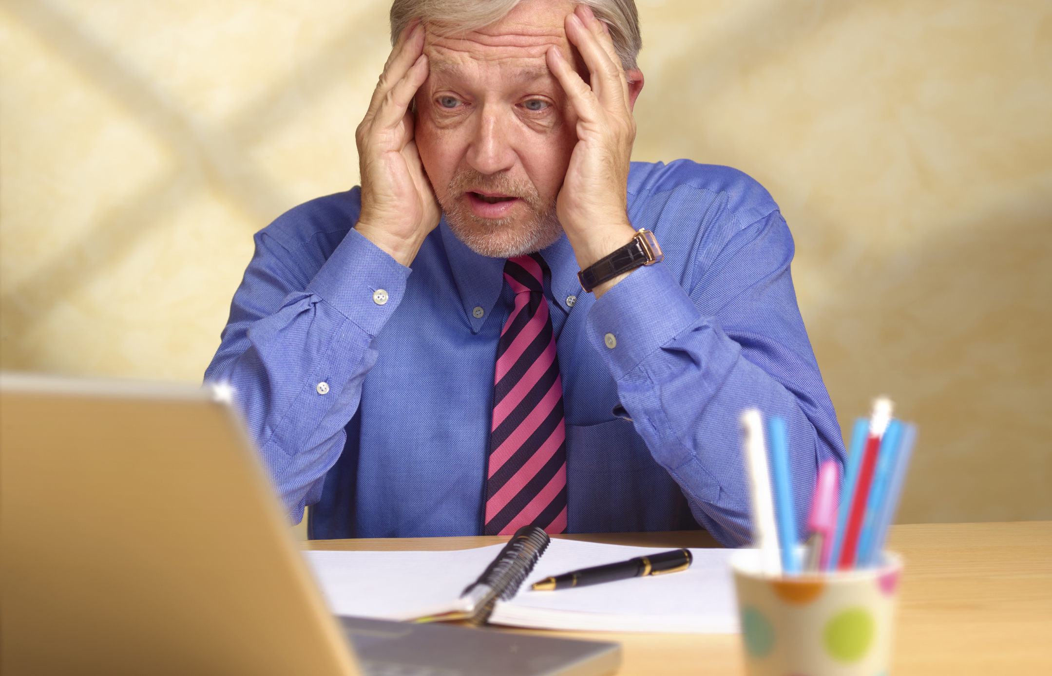 Senior man confused by computer