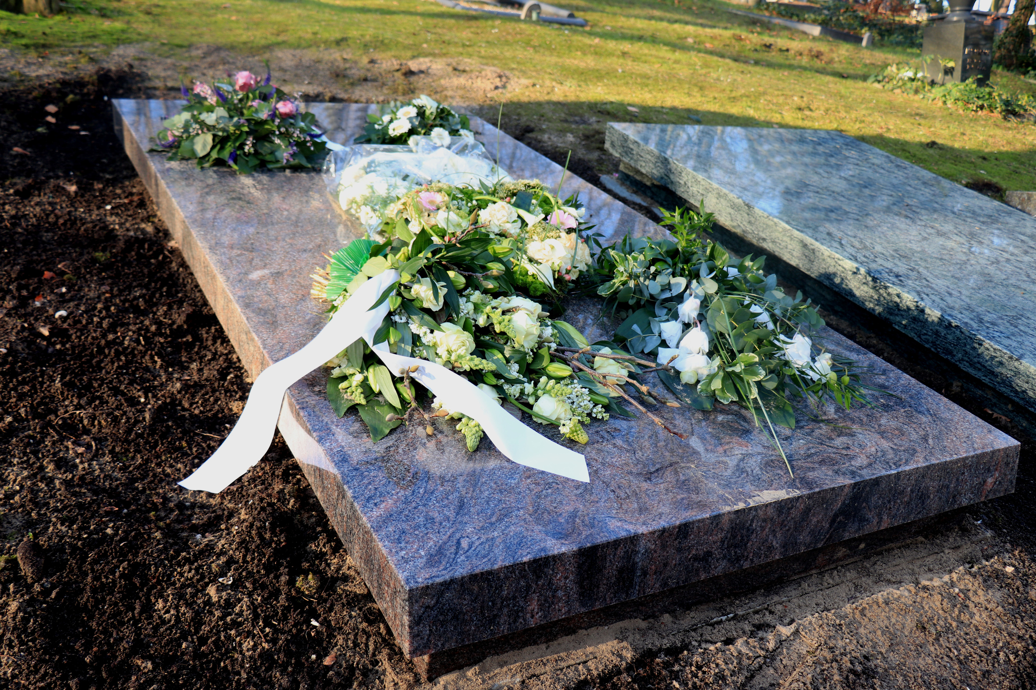 Sympathy flowers on a grave