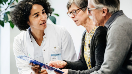 Clinical Doctor Giving Test Results To Patients