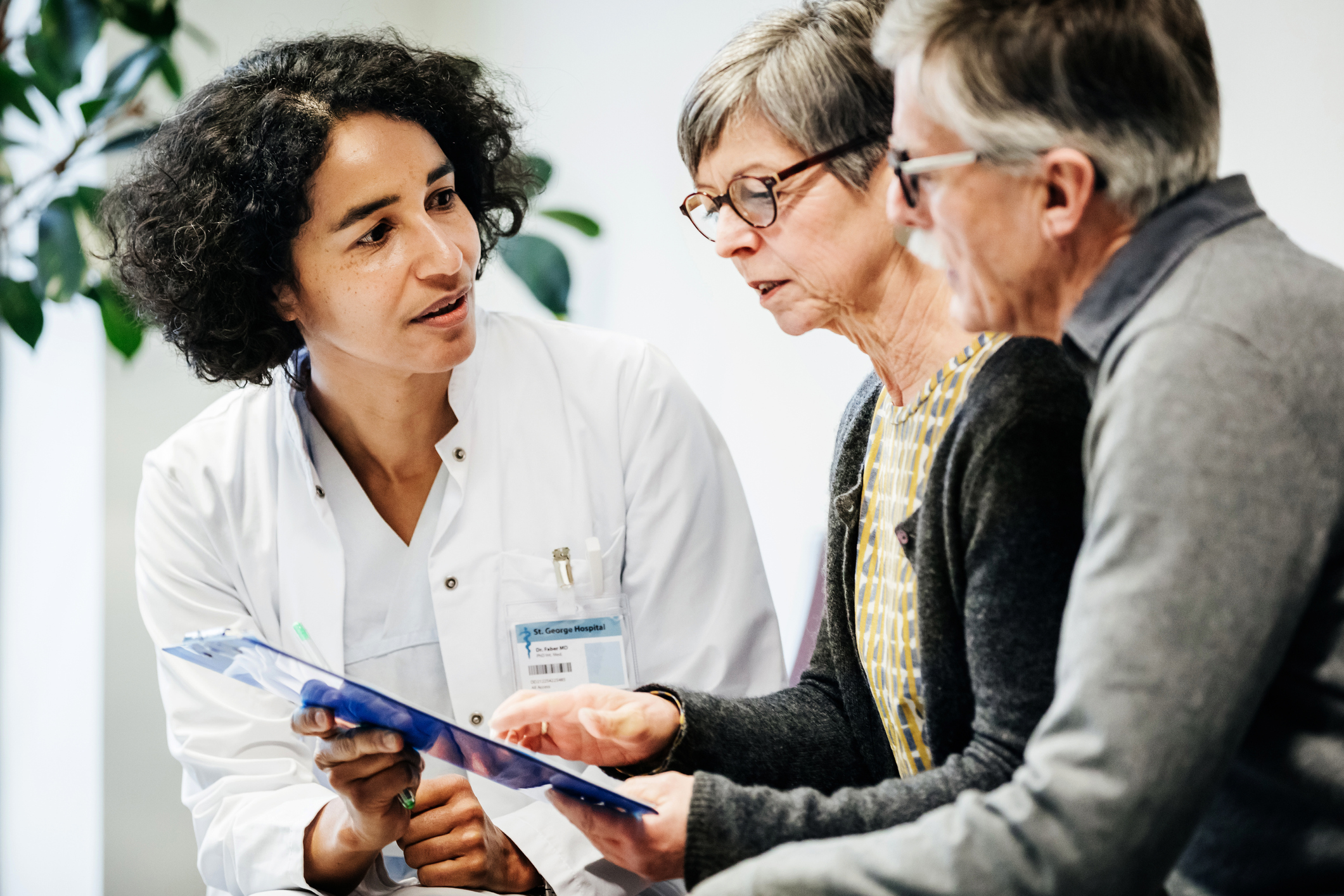 Clinical Doctor Giving Test Results To Patients