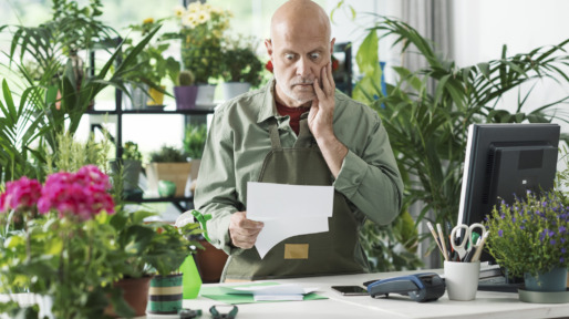 Business owner checking expensive bills