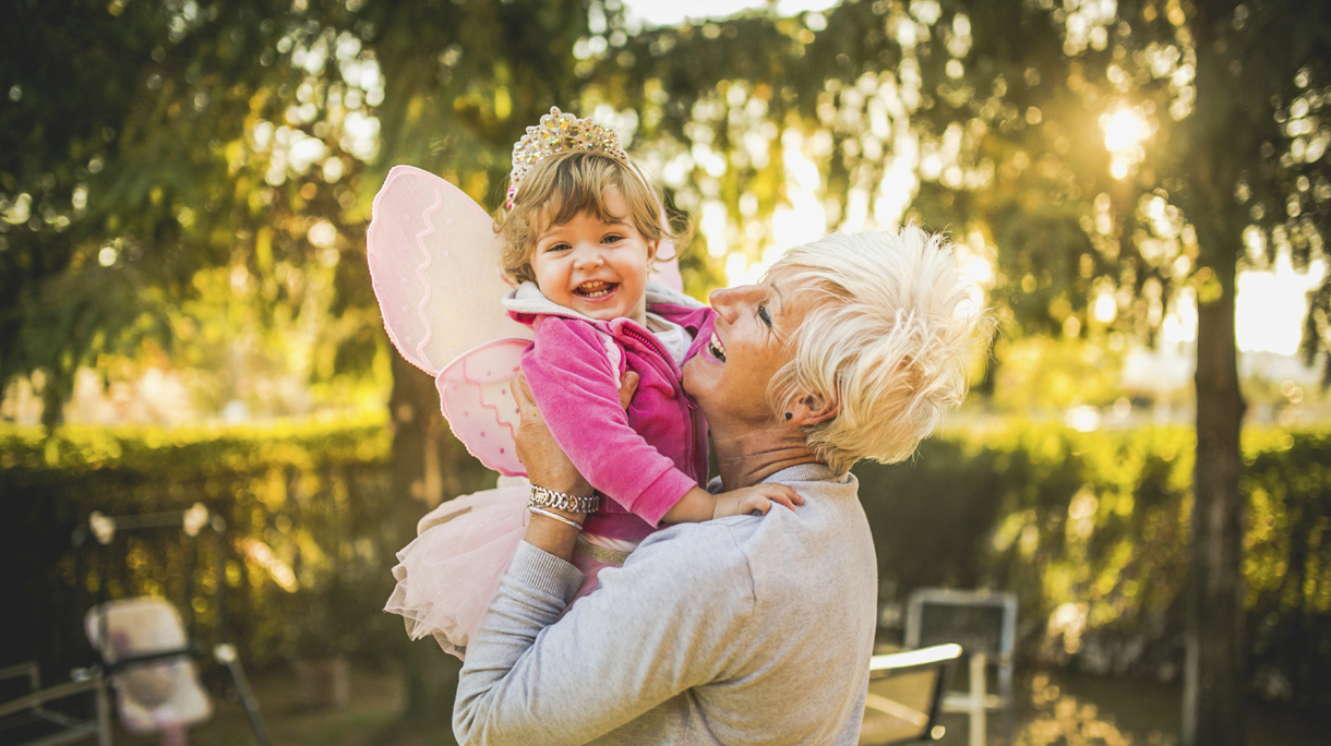 Grandmother holding her granddaughter