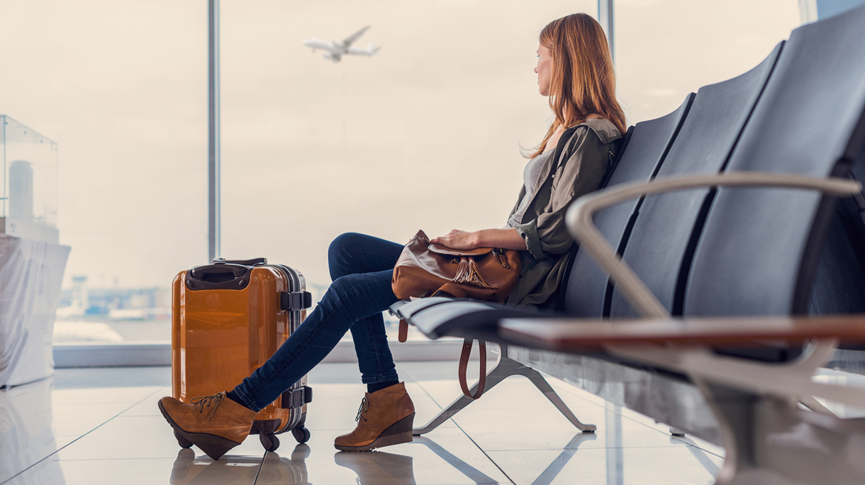 Smiling girl waiting for boarding