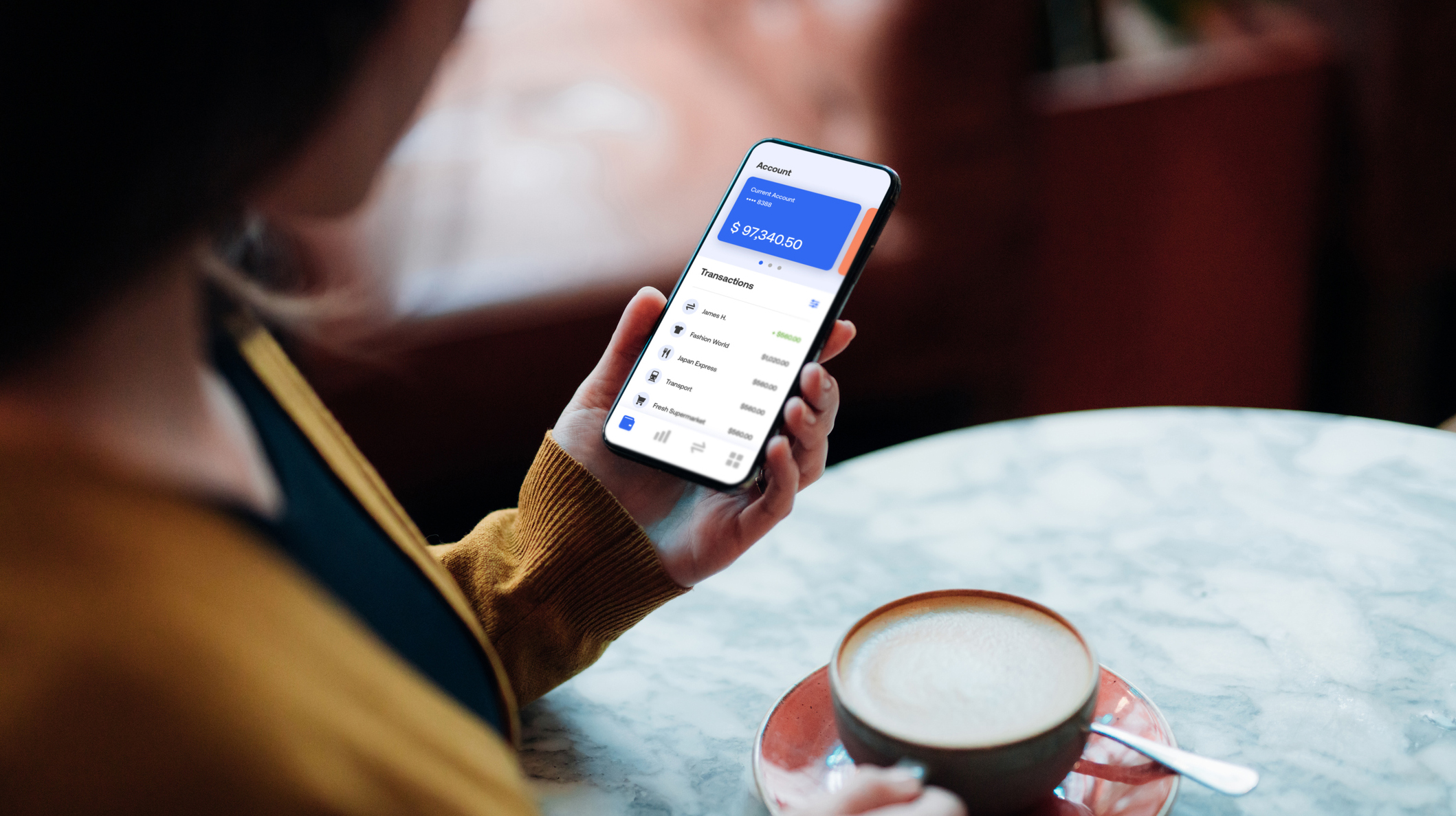 Close-up Shot Of Young Woman Managing Bank Account on Smartphone At Cafe