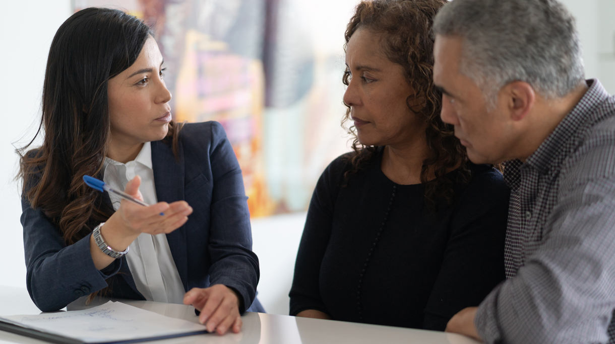 Ethnic Senior Couple With Financial Advisor