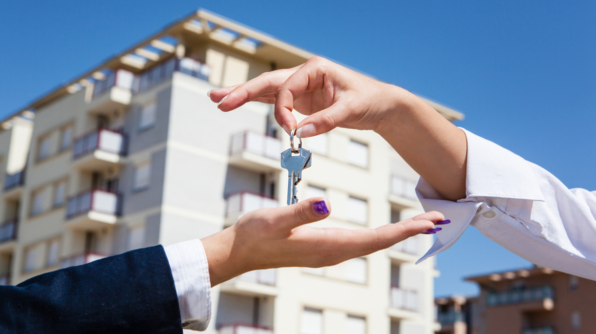 Realtor giving apartment keys