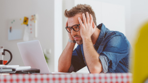 Worried man looking at the laptop screen
