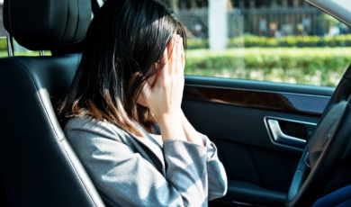 Sad businesswoman driver sitting in car