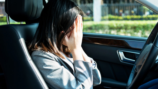 Sad businesswoman driver sitting in car